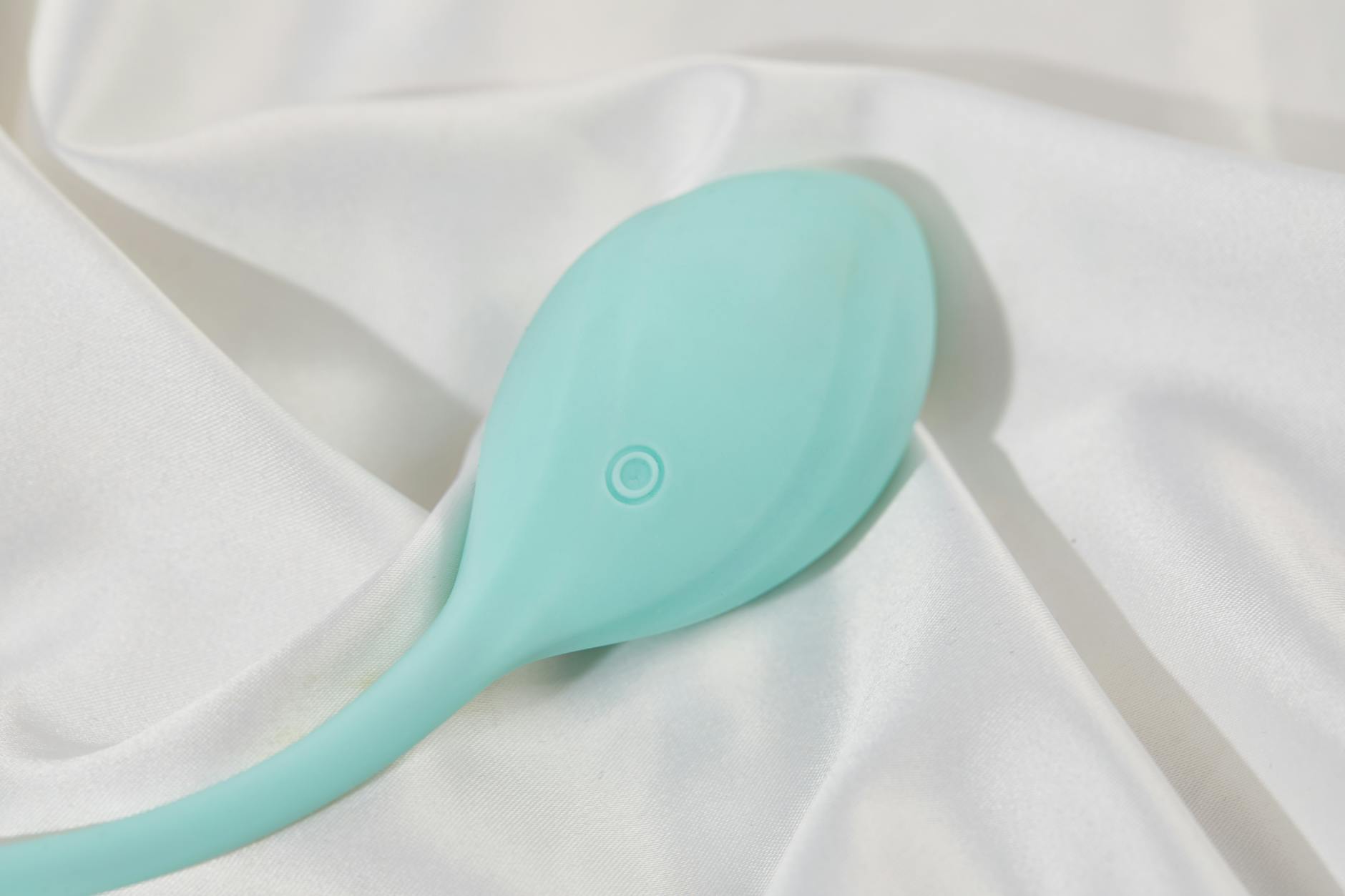 A collection of colorful sex toys on a black tray, featuring diverse shapes for couples exploration